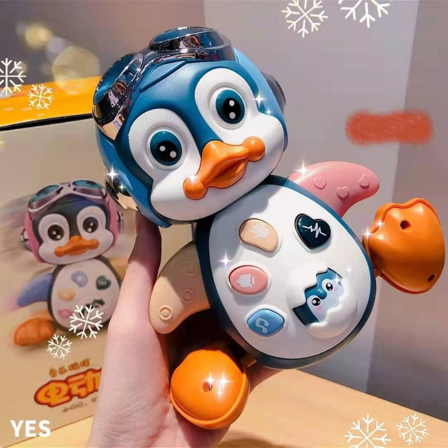 jouet bébé pingouin dans main